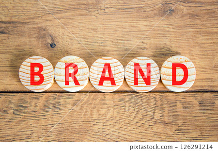 Brand symbol. Concept word Brand on beautiful wooden circles. Beautiful wooden table wooden background. Business brand concept. Copy space. Brand symbol. Concept word Brand on beautiful wooden circles. Beautiful wooden table wooden background. Business brand concept. Copy space. 126291214