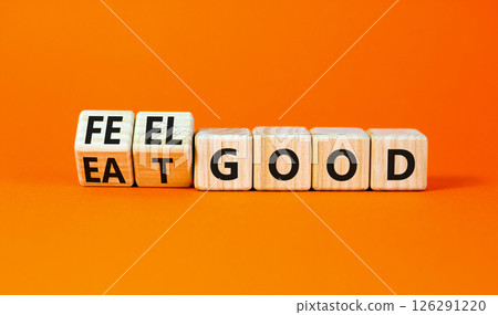 Eat and feel good symbol. Concept words Eat good Feel good on wooden cubes. Beautiful orange table orange background. Healthy lifestyle eat and feel good concept. Copy space. Eat and feel good symbol. Concept words Eat good Feel good on wooden cubes. Beautiful orange table orange background. Healthy lifestyle eat and feel good concept. Copy space. 126291220
