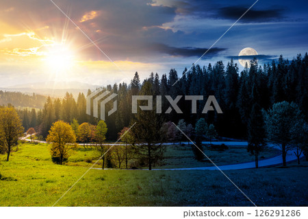 day and night time change concept. road winding through forest in mountain landscape. nature scenery on autumn equinox. cloudy sky with sun and moon 126291286