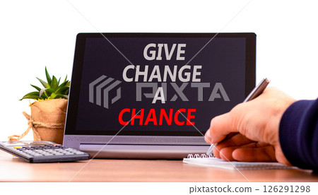 Give change a chance symbol. Concept words phrase Give change a chance on beautiful black tablet. Businessman's hand. Beautiful white background. Business Give change a chance concept. Copy space. 126291298