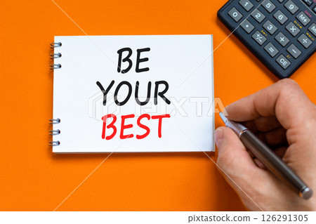 Motivational be your best symbol. Concept words Be your best on beautiful white note. Beautiful orange background. Black pen. Businessman hand. Business motivational be your best concept. Copy space. Motivational be your best symbol. Concept words Be your best on beautiful white note. Beautiful orange background. Black pen. Businessman hand. Business motivational be your best concept. Copy space. 126291305
