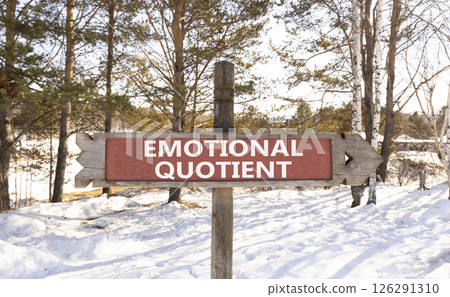 EQ emotional quotient symbol. Concept words EQ emotional quotient on beautiful wooden road sign. Beautiful forest snow sky background. Business psychology EQ emotional quotient concept. Copy space. 126291310