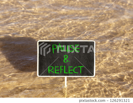 Pause and reflect symbol. Concept words Pause and reflect on beautiful blackboard. Beautiful Red sea water background. Business motivational lifestyle pause and reflect concept. Copy space. 126291321