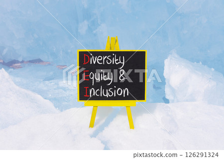DEI diversity equity and inclusion symbol. Concept words DEI diversity equity and inclusion on blackboard. Beautiful ice background. Business DEI diversity equity and inclusion concept. Copy space. 126291324