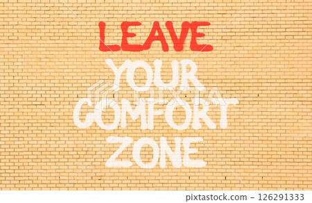 Leave your comfort zone symbol. Concept words Leave your comfort zone on beautiful brick wall. Beautiful brown brick wall background. Business psychological Leave your comfort zone concept. Copy space 126291333