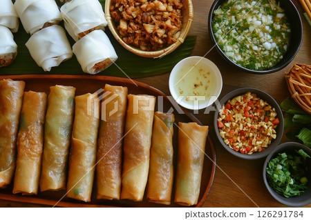Vietnamese cuisine featuring spring rolls, rice paper wraps, and flavorful side dishes 126291784