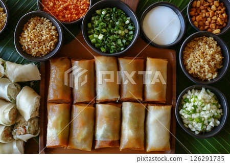 Vietnamese cuisine featuring spring rolls, rice paper wraps, and flavorful side dishes 126291785