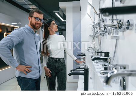 Man and woman is in sanitary ware store choosing products 126291906
