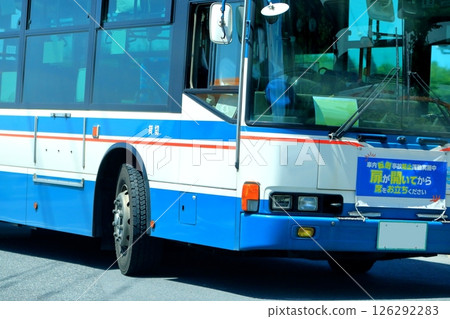 A route bus turning right at an intersection 126292283