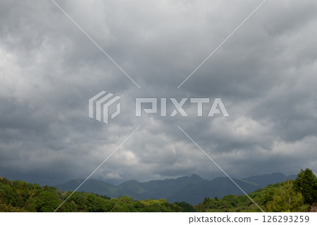 [Suzuka mountain range and cloudy sky] Natural scenery material / Rainy season image material 126293259