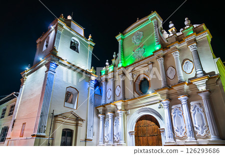 Baroque facade of Sanctuary of Our Lady of La Merced glows under dramatic night lighting in Leon, Nicaragua. 126293686