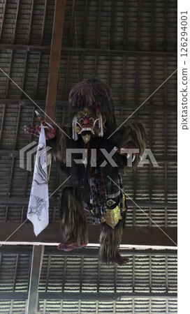 Traditional Rangda Hanging Decoration in Balinese Pavilion with Intricate Handcrafted Details and Sacred Cultural Symbolism in Bali Indonesia Traditional Rangda Hanging Decoration in Balinese Pavilion with Intricate Handcrafted Details and Sacred Cultural Symbolism in Bali Indonesia 126294001