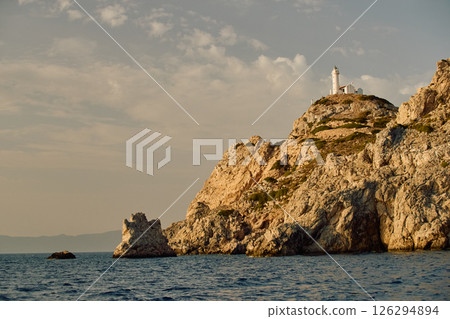 lighthouse on a high mountain at sunset 126294894