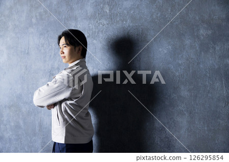 Men in work clothes with arms folded Men in work clothes with arms folded 126295854