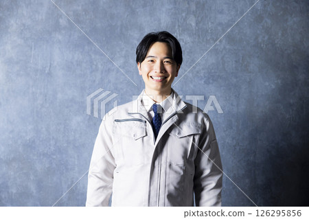 Men in work clothes with arms folded 126295856