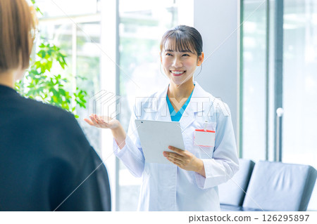 A young lady in white 126295897