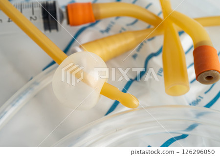 Foley catheter and urine drainage bag collect urine for disability or patient in hospital. Foley catheter and urine drainage bag collect urine for disability or patient in hospital. 126296050