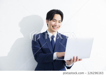 Businessman using a personal computer 126296163