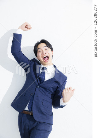 Smiling businessman jumping 126296277