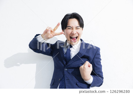 Smiling businessman jumping Smiling businessman jumping 126296280