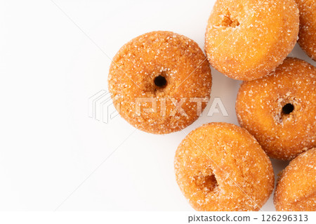 Delicious mini donuts on a white background Delicious mini donuts on a white background 126296313