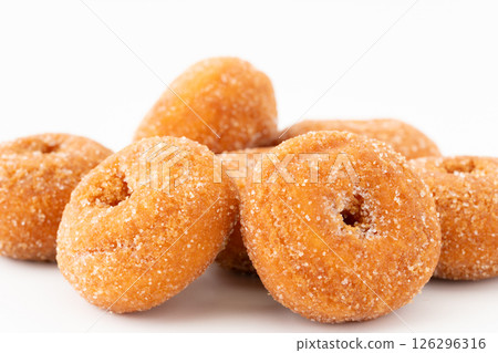 Delicious mini donuts on a white background 126296316
