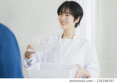 A young lady in white 126296387
