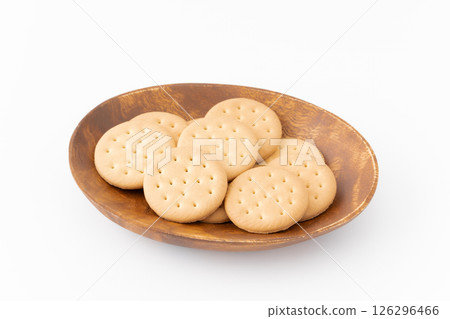 Biscuits on a wooden plate on a white background 126296466