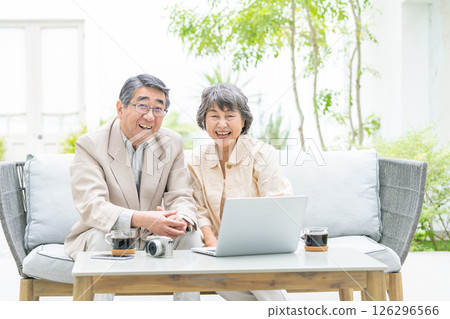 Senior couple, computer, camera 126296566