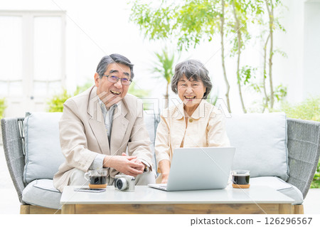 Senior couple, computer, camera 126296567