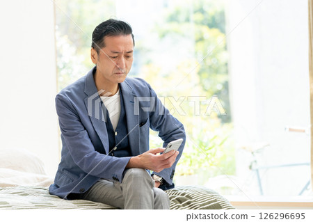 Senior male smartphone Senior male smartphone 126296695