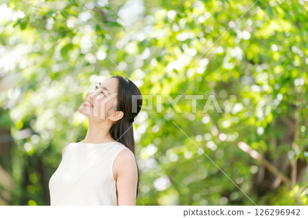 A woman relaxing in the park A woman relaxing in the park 126296942