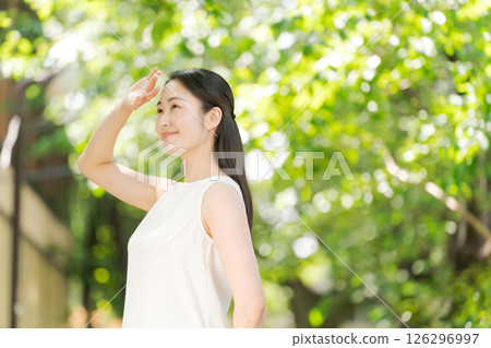 A young woman blocking the sun 126296997