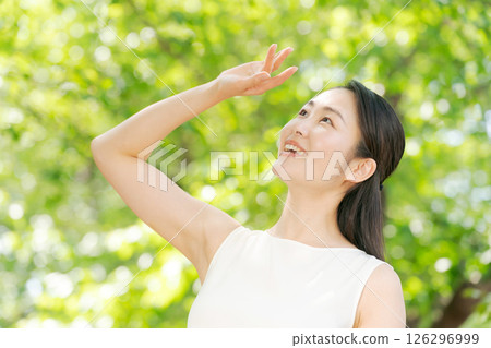 A young woman blocking the sun 126296999