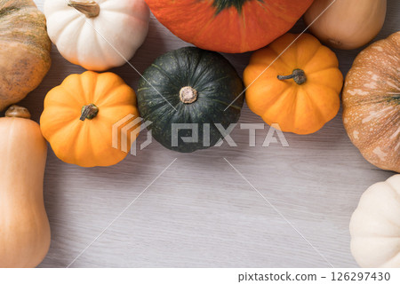 Various pumpkins on white background with copy space, Top view Various pumpkins on white background with copy space, Top view 126297430