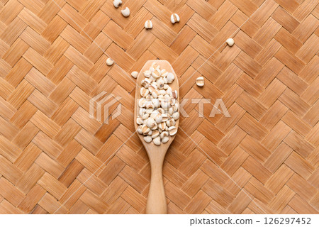 Dried Job's tears or adlay millet seeds in wooden scoop, Food ingredient, Top view 126297452