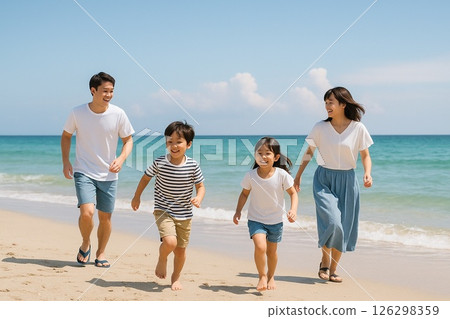 Summer vacation life of today's elementary school students: A smiling family of four running along the beach in summer 126298359