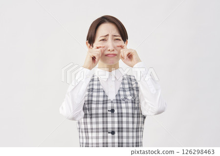 Female office worker crying white background looking at camera Female office worker crying white background looking at camera 126298463