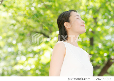 Image of a smiling woman in greenery 126299028