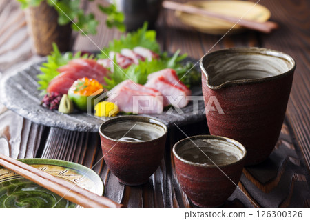Sake and 4 kinds of sashimi 126300326
