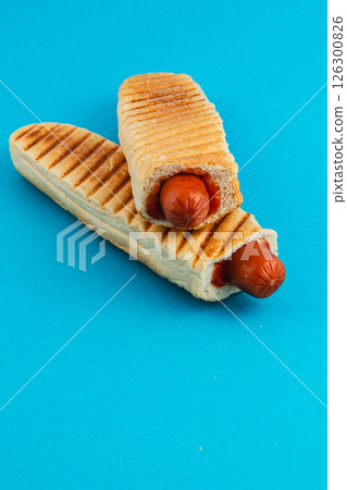 Delicious grilled hot dogs served in toasted bread rolls 126300826