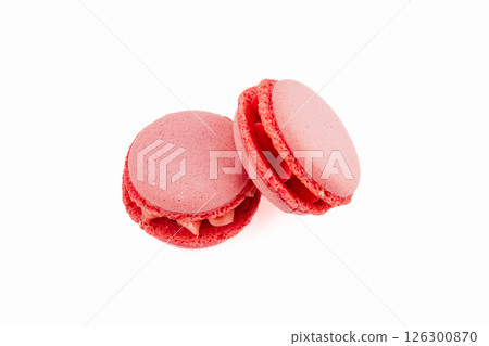 Delicate red macarons with creamy filling on white background 126300870