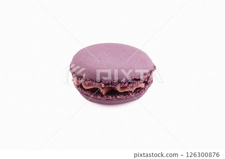Purple macaron with chocolate filling on clean backdrop Purple macaron with chocolate filling on clean backdrop 126300876