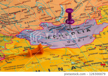 Colorful pushpins marking locations on a map of Mongolia 126300879