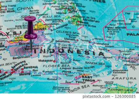 Map highlighting Indonesia with pushpin marker near Borneo 126300885