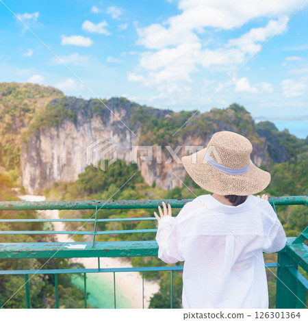 Woman tourist traveling in Krabi, Thailand. happy traveller enjoy and sightseeing view at koh Hong island viewpoint. summer trip, destination, Southeast Asia Travel, vacation and holiday concept 126301364
