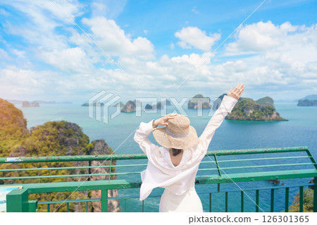 Woman tourist traveling in Krabi, Thailand. happy traveller enjoy and sightseeing view at koh Hong island viewpoint. summer trip, destination, Southeast Asia Travel, vacation and holiday concept 126301365