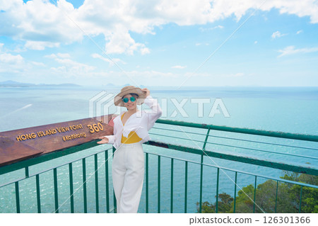 Woman tourist traveling in Krabi, Thailand. happy traveller enjoy and sightseeing view at koh Hong island viewpoint. summer trip, destination, Southeast Asia Travel, vacation and holiday concept Woman tourist traveling in Krabi, Thailand. happy traveller enjoy and sightseeing view at koh Hong island viewpoint. summer trip, destination, Southeast Asia Travel, vacation and holiday concept 126301366
