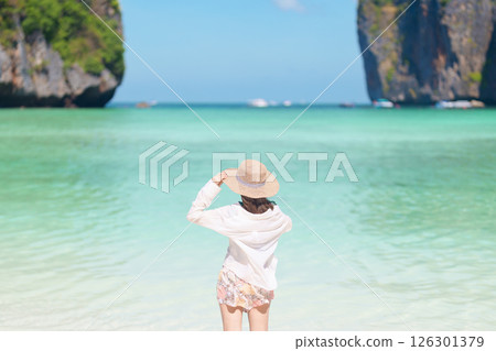 Woman tourist traveling and sightseeing in Krabi, Thailand, happy traveller enjoy at Maya Bay beach on Phi Phi island, Popular paradise island, destination, Southeast Asia Travel, vacation and holiday Woman tourist traveling and sightseeing in Krabi, Thailand, happy traveller enjoy at Maya Bay beach on Phi Phi island, Popular paradise island, destination, Southeast Asia Travel, vacation and holiday 126301379