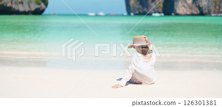 Woman tourist traveling and sightseeing in Krabi, Thailand, happy traveller enjoy at Maya Bay beach on Phi Phi island, Popular paradise island, destination, Southeast Asia Travel, vacation and holiday 126301381